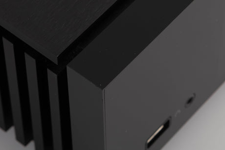 Close up of a used Naim Uniti Atom Integrated System in a Black finish showing small dinks on front left corner