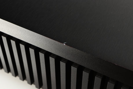 Close up of a used Naim Uniti Star Integrated Music System in a black finish showing small chip on left edge