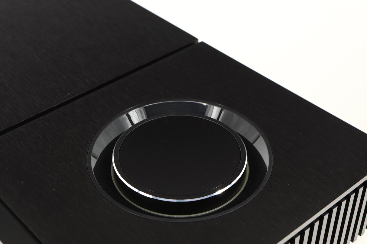 Close up of a used Naim Uniti Star Streaming System in a black finish showing some scratching inside dial