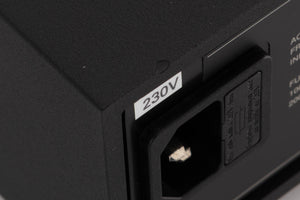 Close up of a used Naim XPS-2 Power Supply in a Black finish showing chip on rear edge