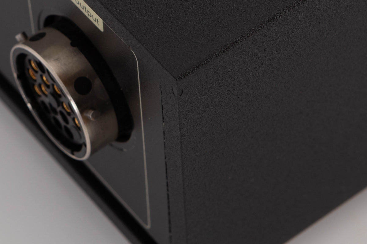 Close up of a used Naim XPS-2 Power Supply in a Black finish showing chip on rear left edge
