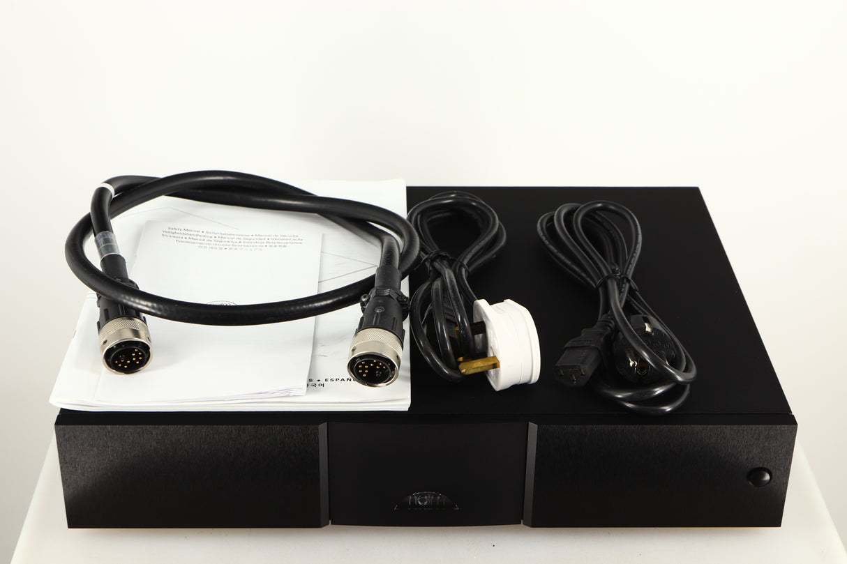 Top of a used Naim XPS DR Power Supply in a black finish showing Burndy Cable, Mains Cable, Manual and Schuko Cable