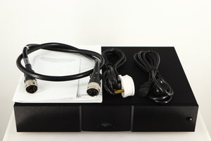 Top of a used Naim XPS DR Power Supply in a black finish showing Burndy Cable, Mains Cable, Manual and Schuko Cable