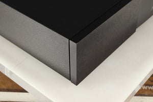 Front left corner of a used Naim XPS DR Power Supply in a black finish