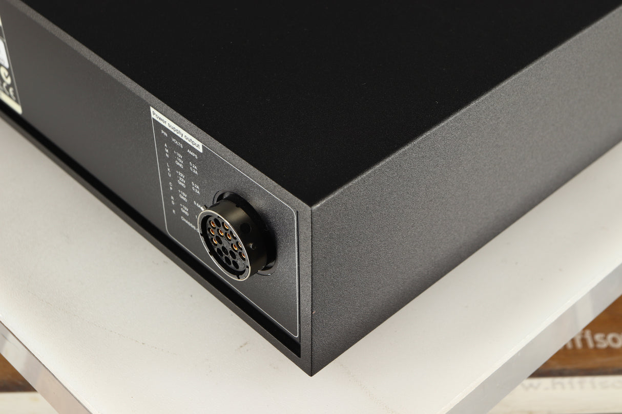 Rear left corner of a used Naim XPS DR Power Supply in a black finish