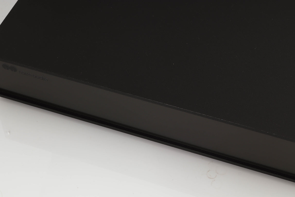 Close up of a used Naim XPS Power Supply in a black finish showing some of the fascia