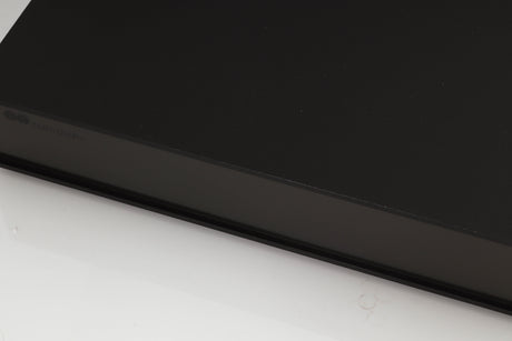 Close up of a used Naim XPS Power Supply in a black finish showing some of the fascia