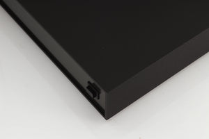 Front right corner of a used Naim XPS Power Supply in a black finish