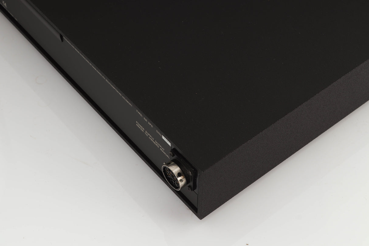 Rear left corner of a used Naim XPS Power Supply in a black finish