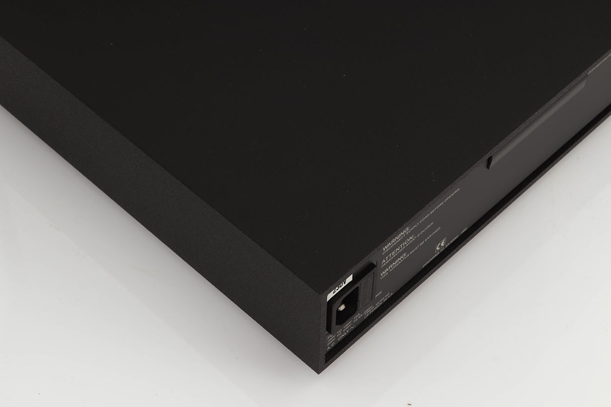 Rear right corner of a used Naim XPS Power Supply in a black finish