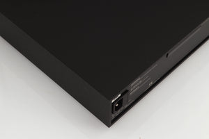 Rear right corner of a used Naim XPS Power Supply in a black finish