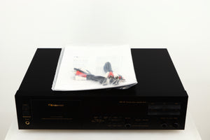 Top of a used Nakamichi DR-10 Cassette Deck in a black finish showing Manual and 2x Interconnect Cables
