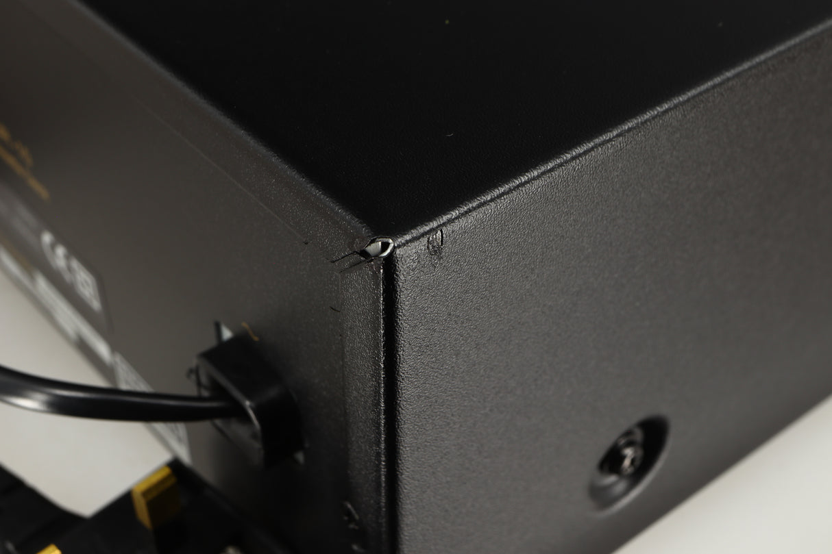 Close up of a used Nakamichi DR-10 Cassette Deck in a black finish showing small nick on rear left corner