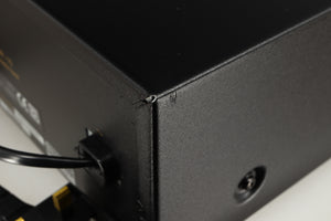 Close up of a used Nakamichi DR-10 Cassette Deck in a black finish showing small nick on rear left corner