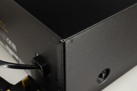 Close up of a used Nakamichi DR-10 Cassette Deck in a black finish showing small nick on rear left corner