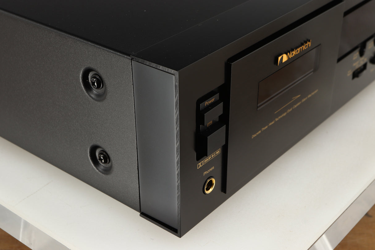 Front left corner of a used Nakamichi DR-10 Cassette Deck in a black finish