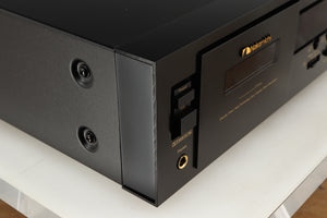 Front left corner of a used Nakamichi DR-10 Cassette Deck in a black finish