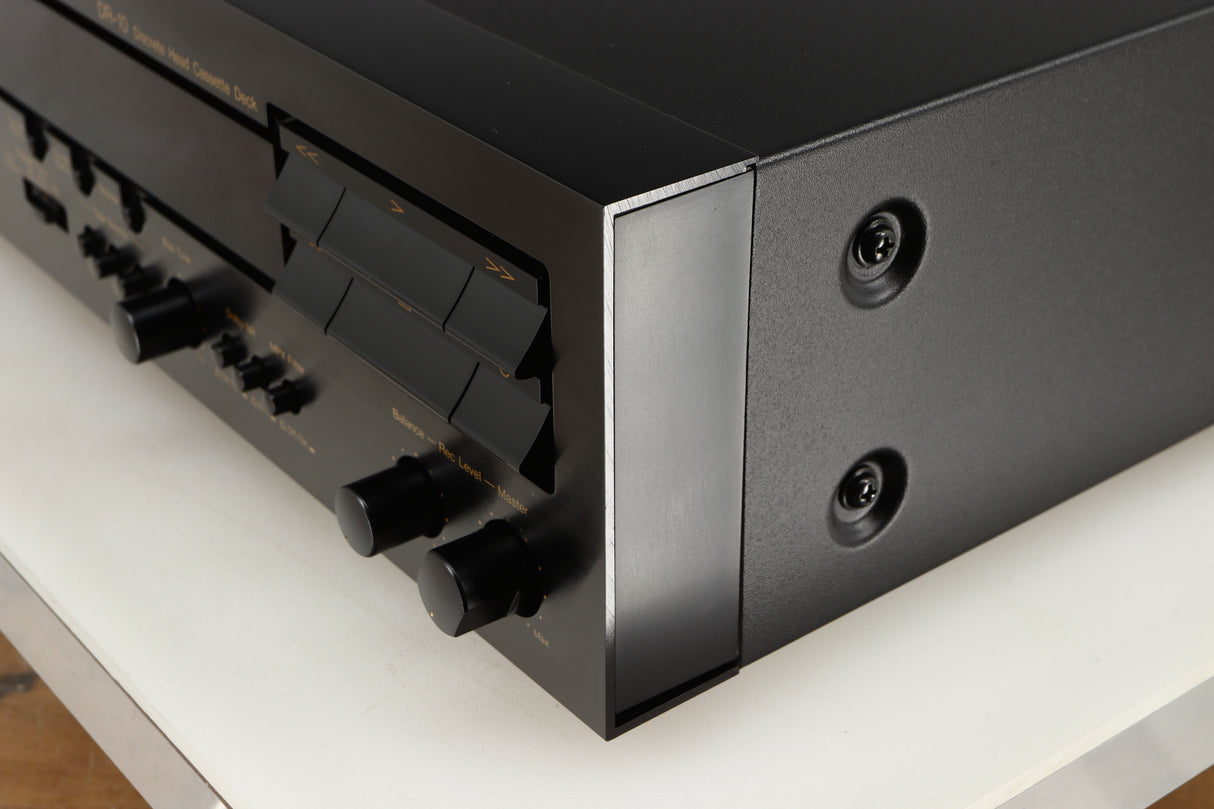 Front right corner of a used Nakamichi DR-10 Cassette Deck in a black finish