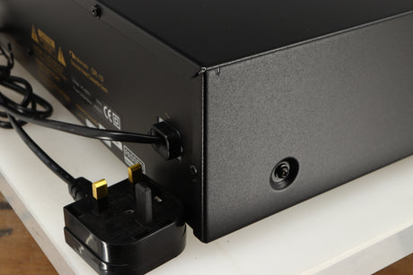 Rear left corner of a used Nakamichi DR-10 Cassette Deck in a black finish