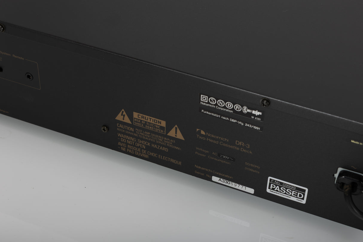 Close up of a used Nakamichi DR-3 Cassette Deck in a black finish showing serial number