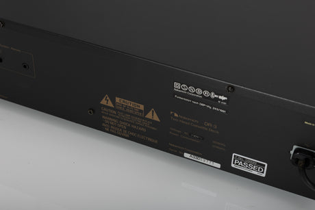 Close up of a used Nakamichi DR-3 Cassette Deck in a black finish showing serial number