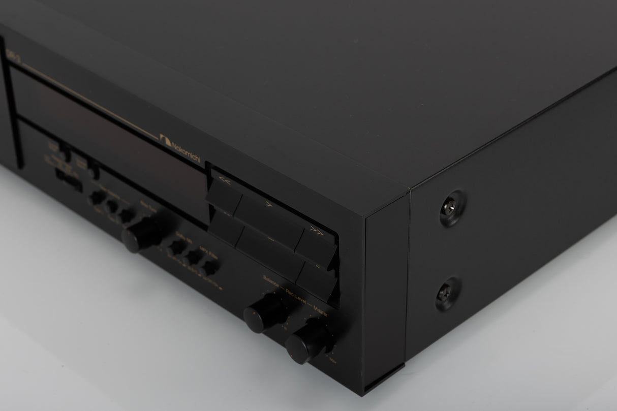Front right corner of a used Nakamichi DR-3 Cassette Deck in a black finish
