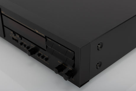 Front right corner of a used Nakamichi DR-3 Cassette Deck in a black finish