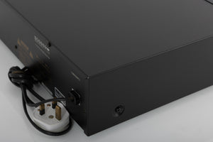 Rear left corner of a used Nakamichi DR-3 Cassette Deck in a black finish