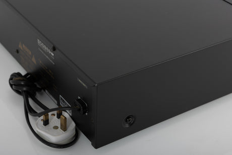 Rear left corner of a used Nakamichi DR-3 Cassette Deck in a black finish
