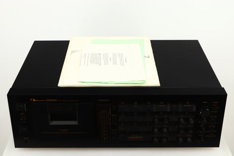 Top of a used Nakamichi Dragon Cassette Deck in a black finish showing Manual