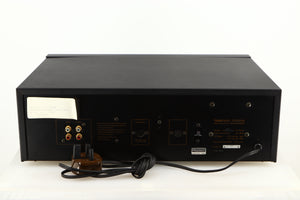 Rear view of a used Nakamichi Dragon Cassette Deck in a black finish showing Phono Inputs, Phono Outputs and DC Output