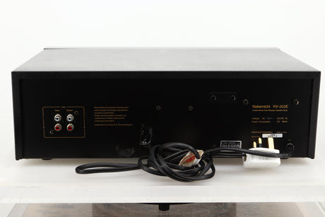 Rear view of a used Nakamichi RX-202E Cassette Deck showing RCA input and output