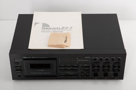 Top of a used Nakamichi ZX-7 Cassette Deck in a black finish showing Manual and Cleaning Cloth