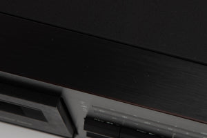 Close up of a used Nakamichi ZX-7 Cassette Deck in a black finish showing scratches on top