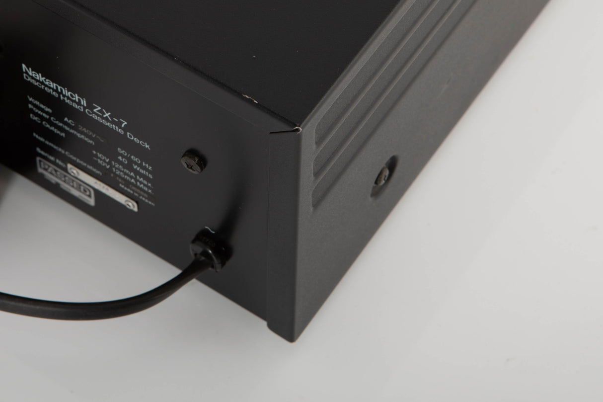 Rear left corner of a used Nakamichi ZX-7 Cassette Deck in a black finish