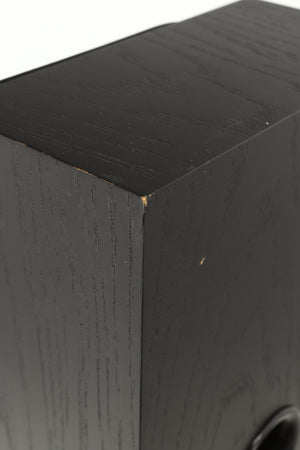 Close up view of a used NEAT Acoustics Iota Alpha Floorstanding Speaker in Black Oak finish showing damage to the paint on the back corner