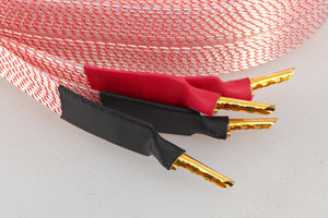 Close up of a used Nordost Heimdall 2 Speaker Cables 2.0m Pair in a pink finish showing connectors