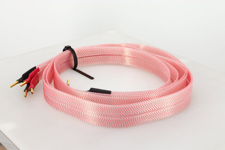 Front right angle of a used Nordost Heimdall 2 Speaker Cables 2.0m Pair in a pink finish