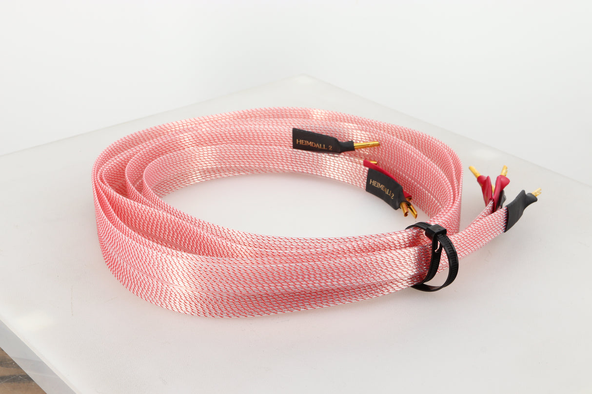 Rear left angle of a used Nordost Heimdall 2 Speaker Cables 2.0m Pair in a pink finish