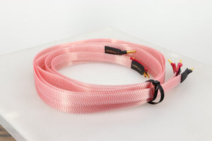 Rear left angle of a used Nordost Heimdall 2 Speaker Cables 2.0m Pair in a pink finish