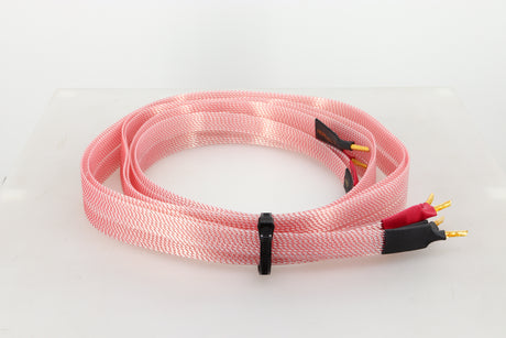Left side view of a used Nordost Heimdall 2 Speaker Cables 2.0m Pair in a pink finish