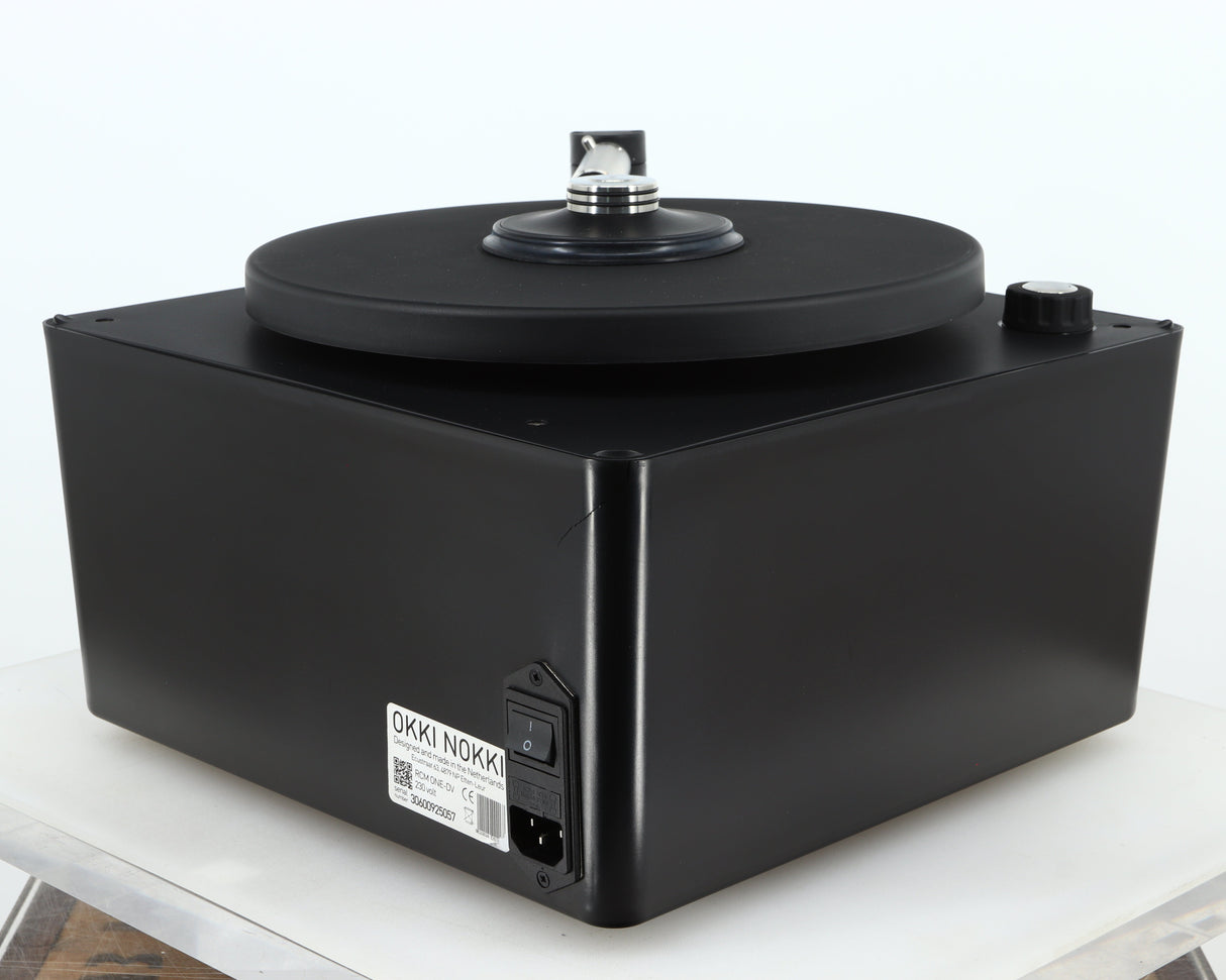 Rear left corner of a used Okki Nokki One Record Cleaning Machine in a black finish