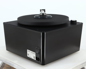 Rear left corner of a used Okki Nokki One Record Cleaning Machine in a black finish