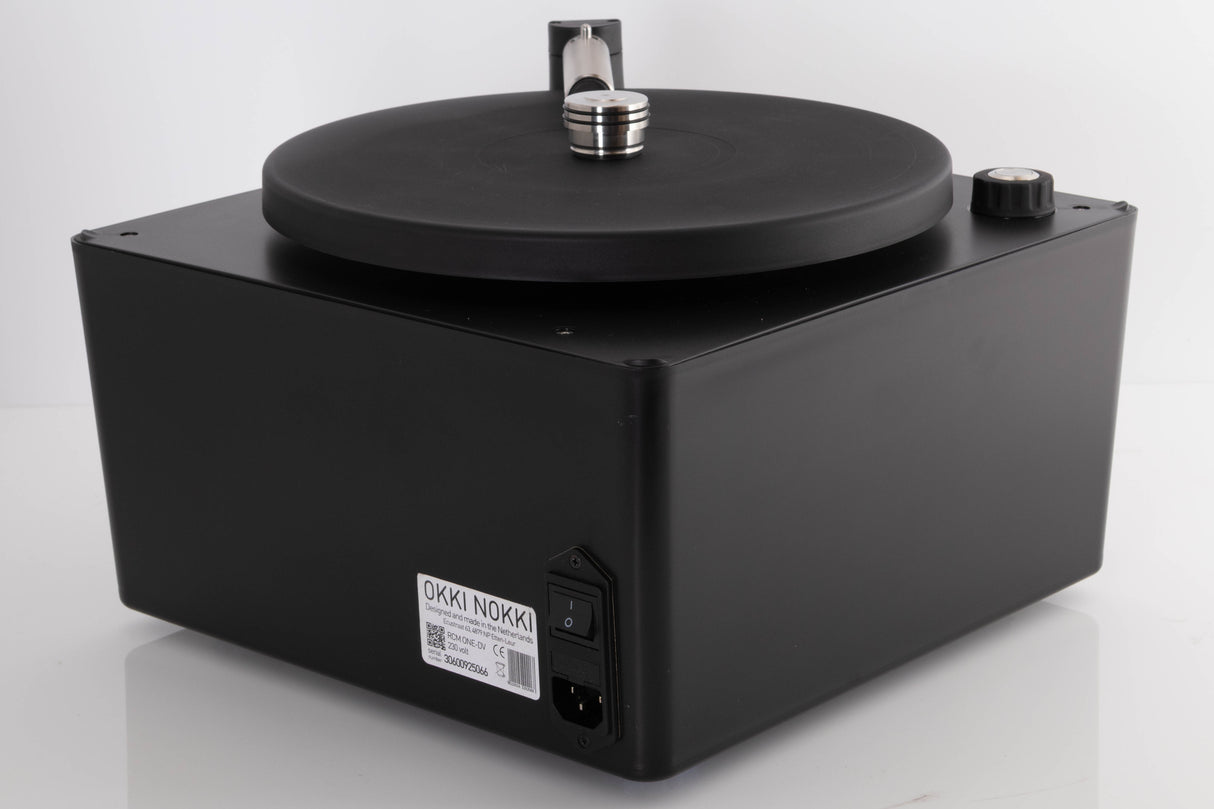 Rear left corner of a used Okki Nokki One Record Cleaning Machine in a Black finish