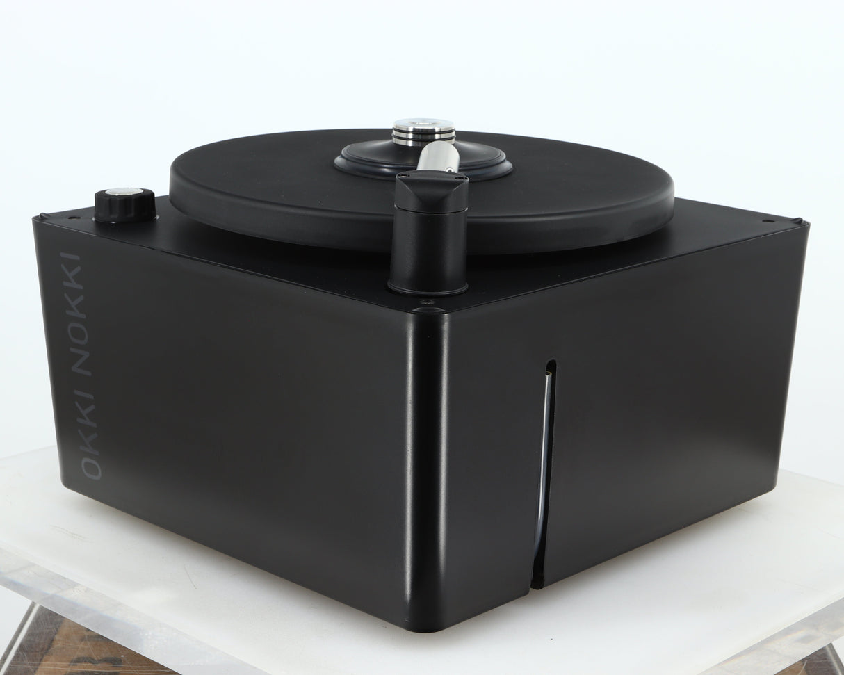Front right corner of a used Okki Nokki One Record Cleaning Machine in a black finish