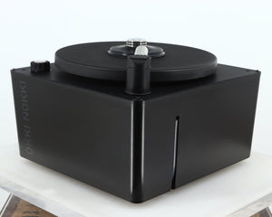 Front right corner of a used Okki Nokki One Record Cleaning Machine in a black finish