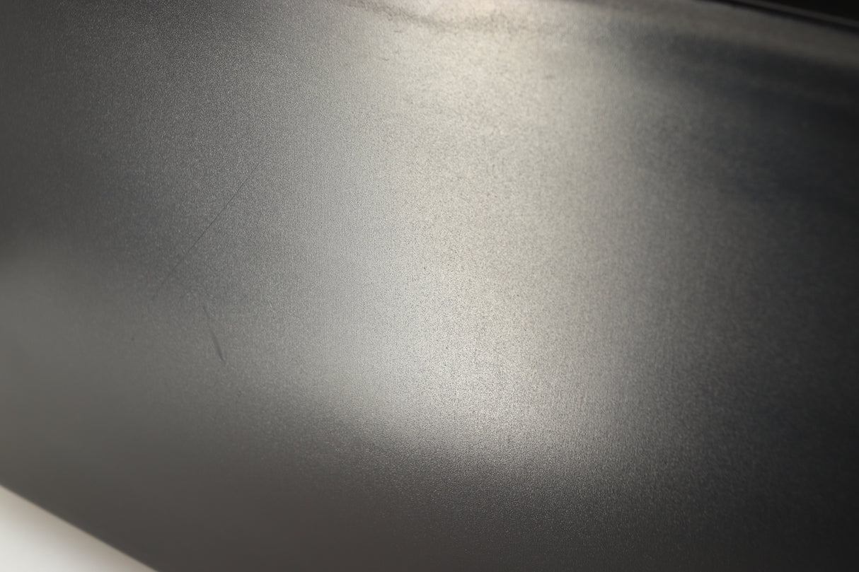 Close up of a used Okki Nokki One Record Cleaning Machine in a black finish showing scratches on left side