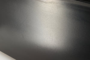 Close up of a used Okki Nokki One Record Cleaning Machine in a black finish showing scratches on left side