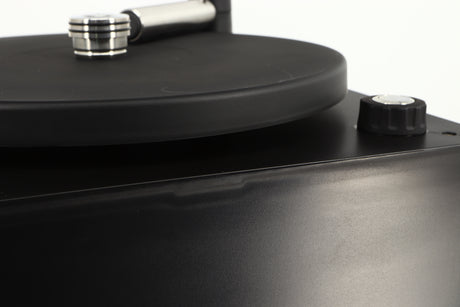 Close up of a used Okki Nokki One Record Cleaning Machine in a black finish showing some marks on casework