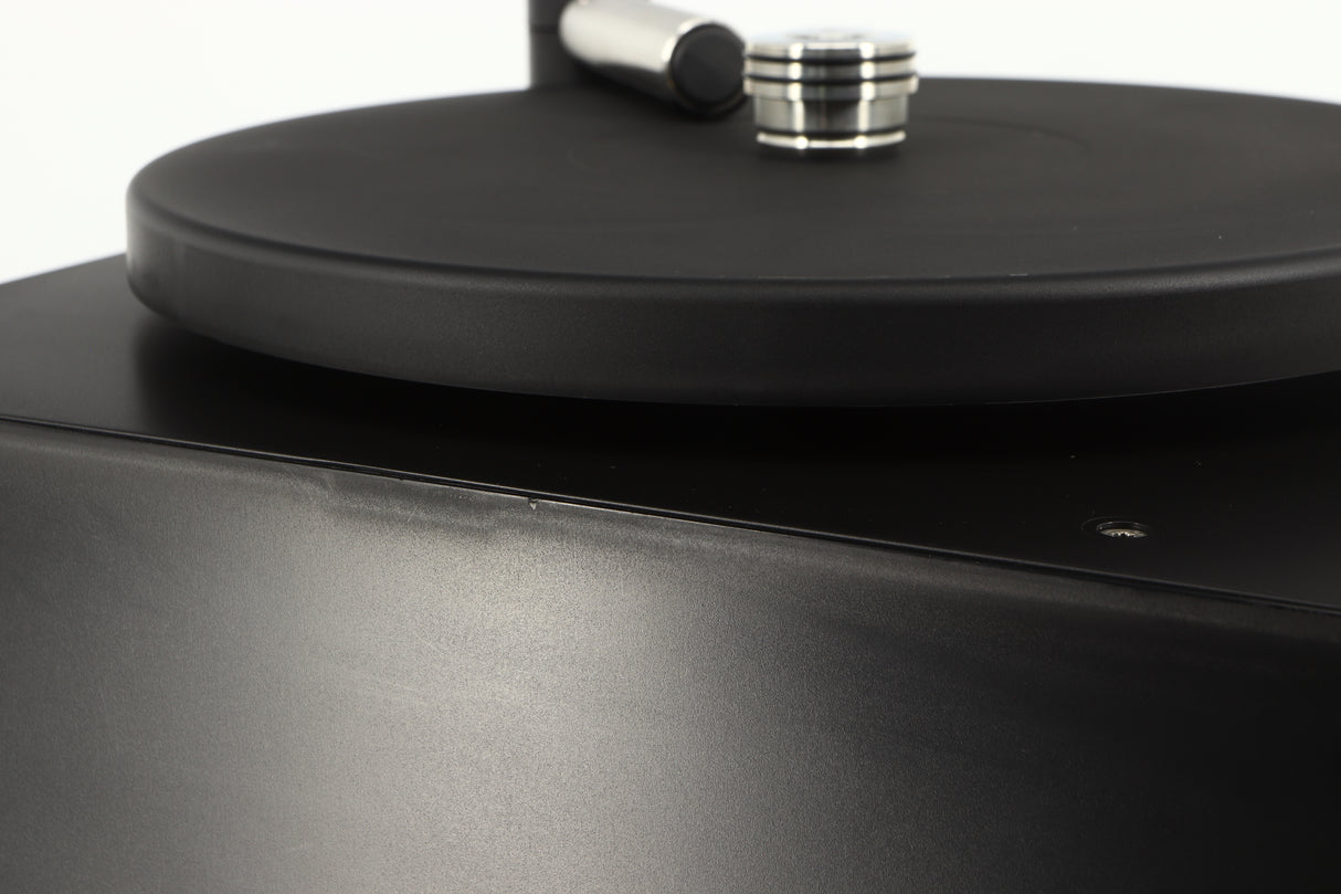 Close up of a used Okki Nokki One Record Cleaning Machine in a black finish showing some marks on casework